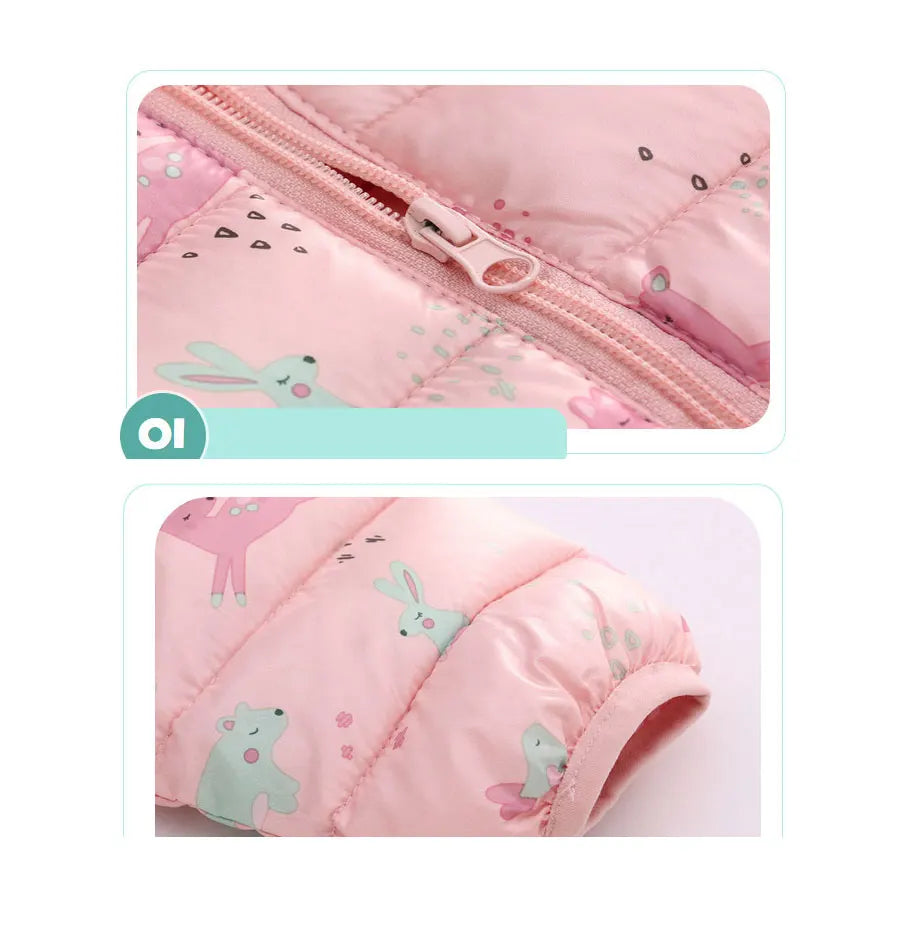 Close-up of pink baby jacket with animal print and zipper, soft quilted cotton fabric.