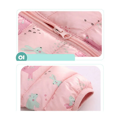 Close-up of pink baby jacket with animal print and zipper, soft quilted cotton fabric.