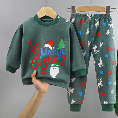 Green baby Christmas outfit set with festive print, reindeer, snowflakes, and Merry Christmas text.